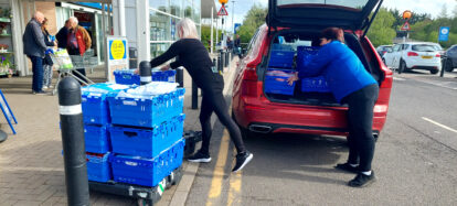 Loading the car with Tesco donated uniforms