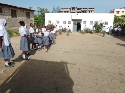 The children happily playing in their playground