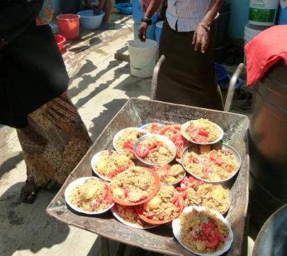 Meals being delivered in an old wheelbarrow